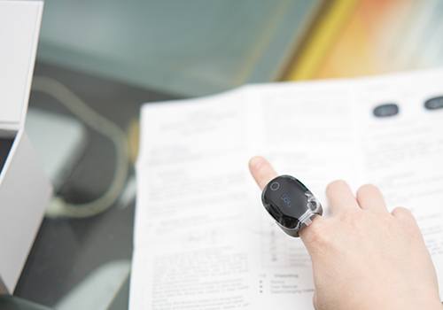 Person wearing smart ring on index finger